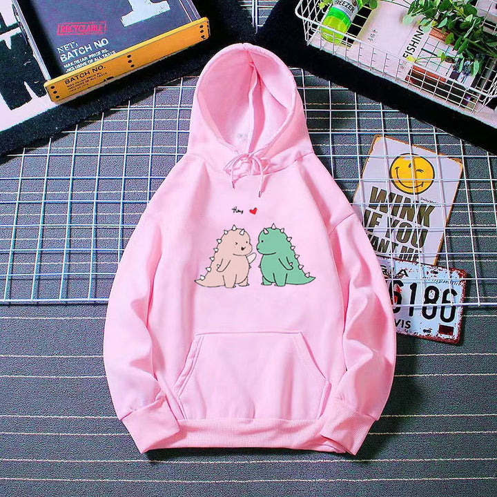 Kvinnors hoodie med lekfullt dinosaurmotiv Mirla-Eva Jonsson