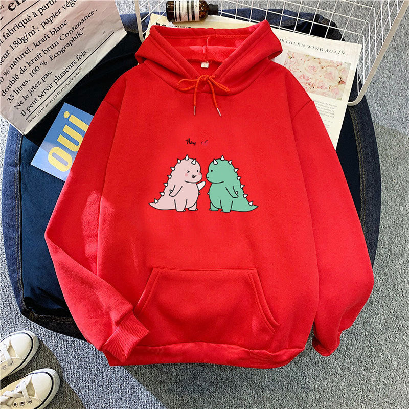 Kvinnors hoodie med lekfullt dinosaurmotiv Mirla-Eva Jonsson