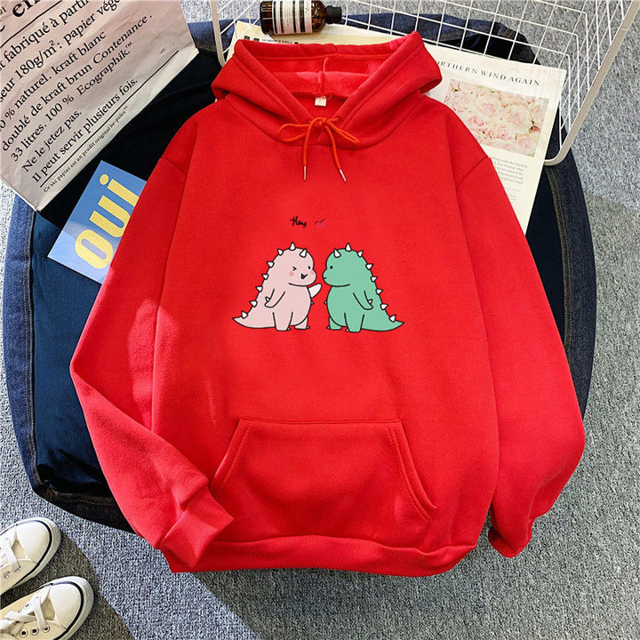 Kvinnors hoodie med lekfullt dinosaurmotiv Mirla-Eva Jonsson