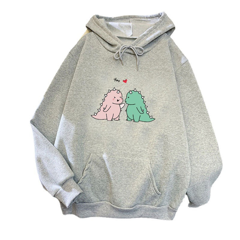 Kvinnors hoodie med lekfullt dinosaurmotiv Mirla-Eva Jonsson