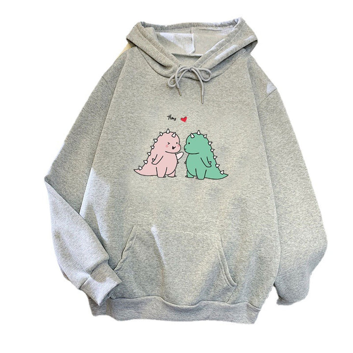 Kvinnors hoodie med lekfullt dinosaurmotiv Mirla-Eva Jonsson