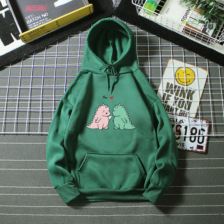 Kvinnors hoodie med lekfullt dinosaurmotiv Mirla-Eva Jonsson