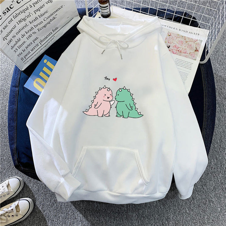 Kvinnors hoodie med lekfullt dinosaurmotiv Mirla-Eva Jonsson