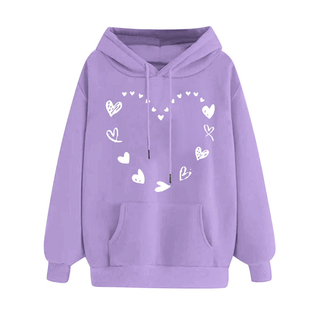 Kvinnors hoodie med lekfullt hjärtdesign och bekväm känguruficka Mirla-Eva Jonsson