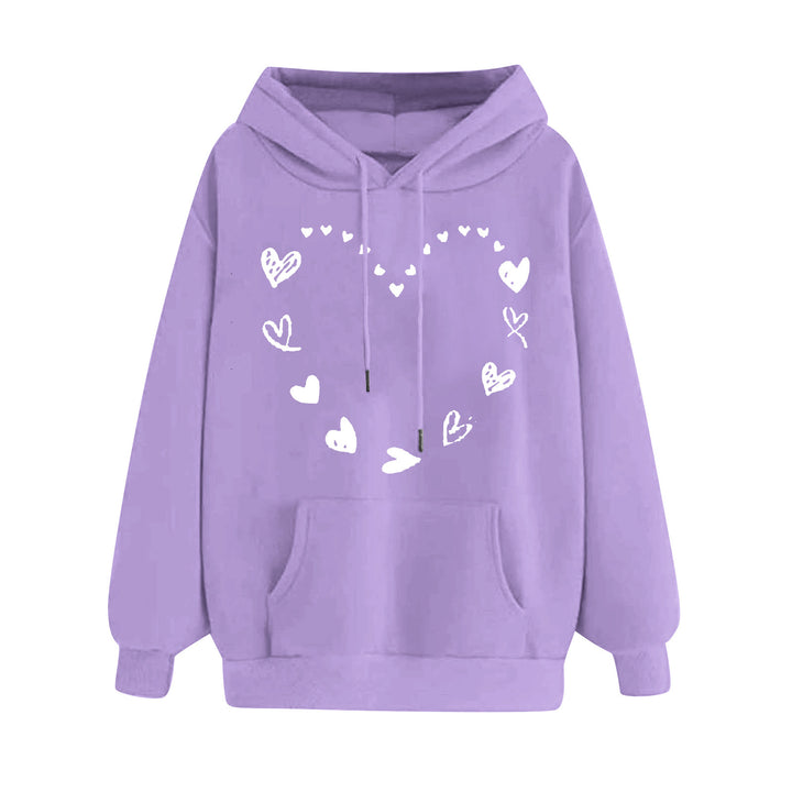 Kvinnors hoodie med lekfullt hjärtdesign och bekväm känguruficka Mirla-Eva Jonsson
