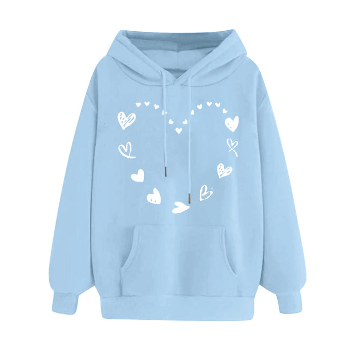 Kvinnors hoodie med lekfullt hjärtdesign och bekväm känguruficka Mirla-Eva Jonsson