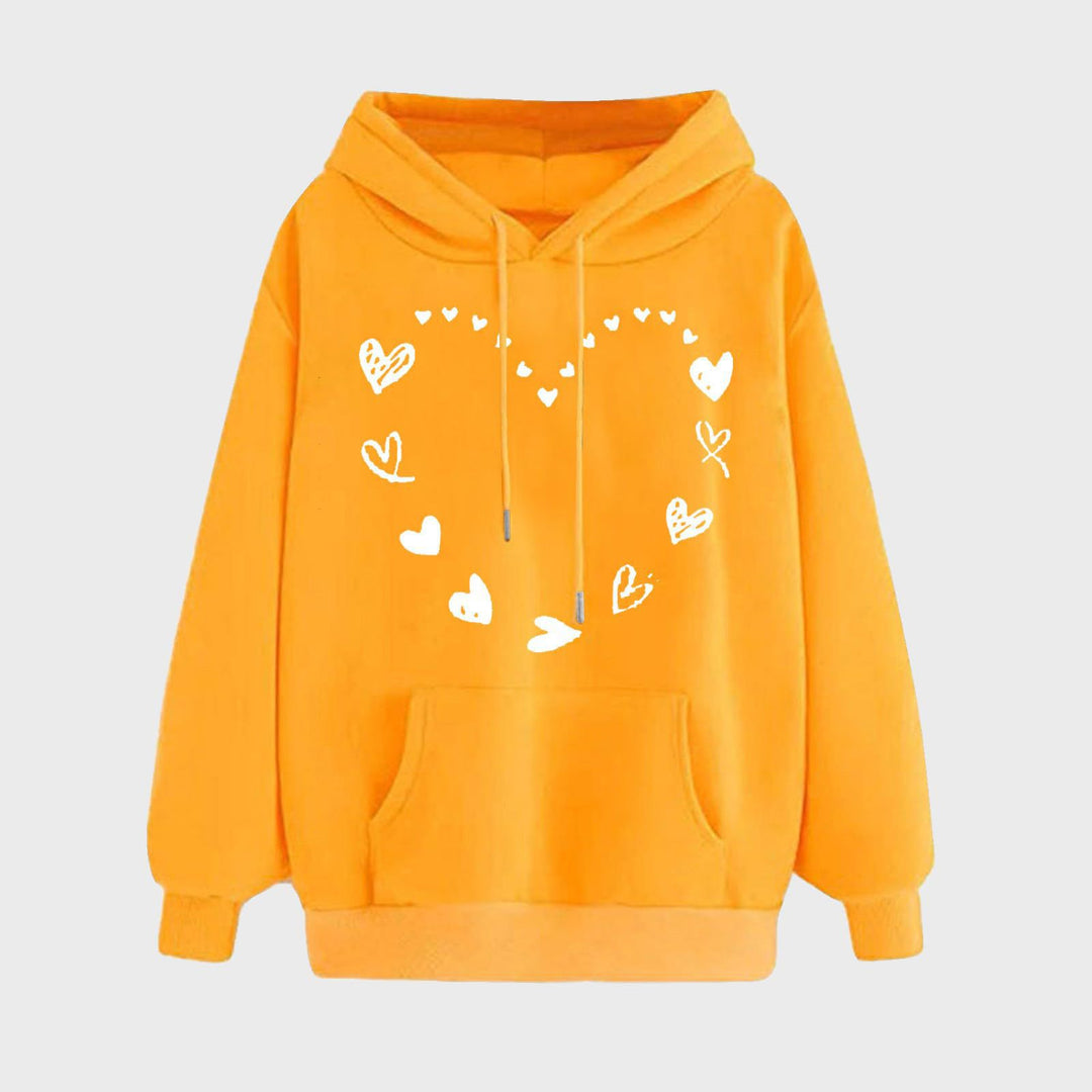 Kvinnors hoodie med lekfullt hjärtdesign och bekväm känguruficka Mirla-Eva Jonsson