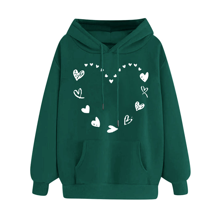 Kvinnors hoodie med lekfullt hjärtdesign och bekväm känguruficka Mirla-Eva Jonsson