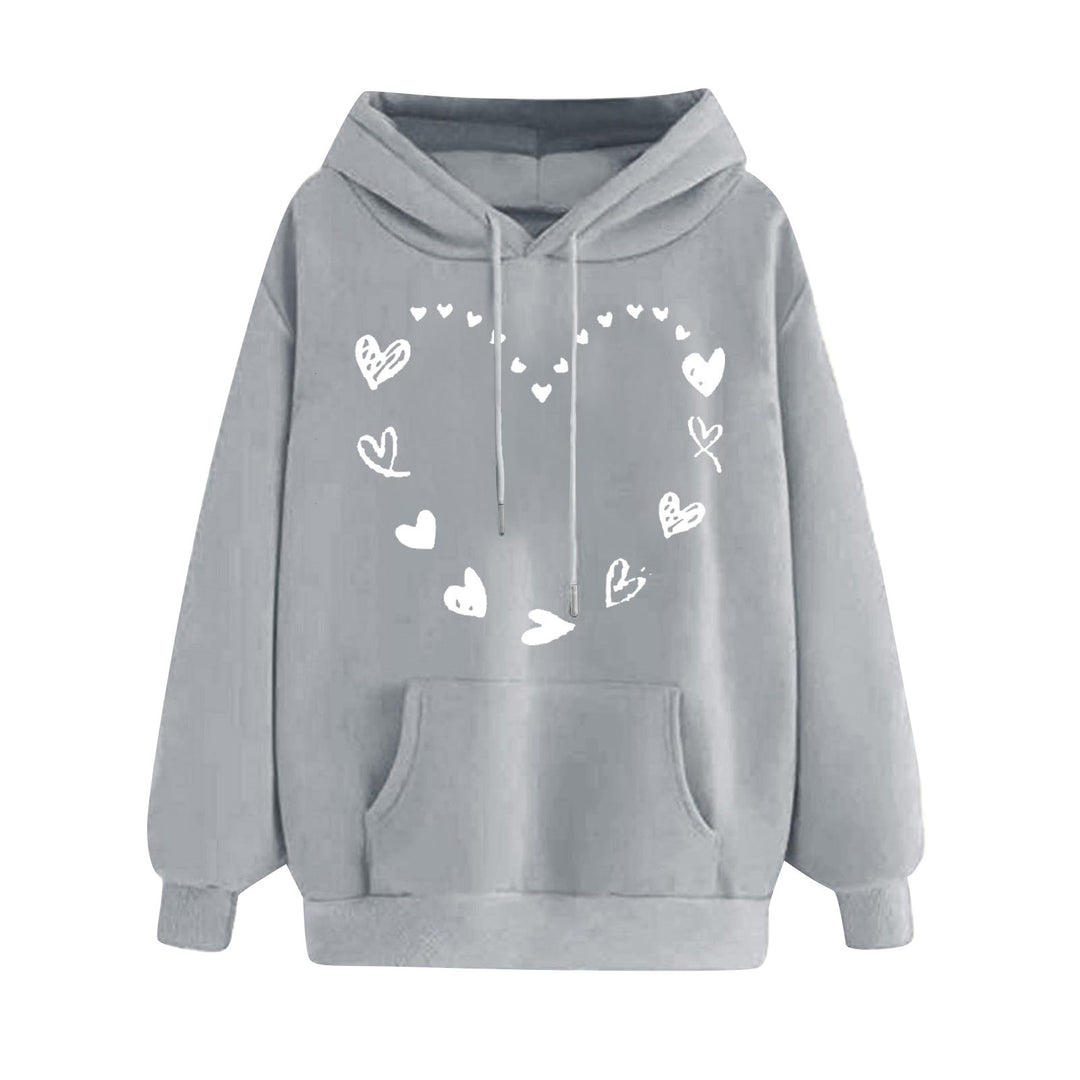 Kvinnors hoodie med lekfullt hjärtdesign och bekväm känguruficka Mirla-Eva Jonsson