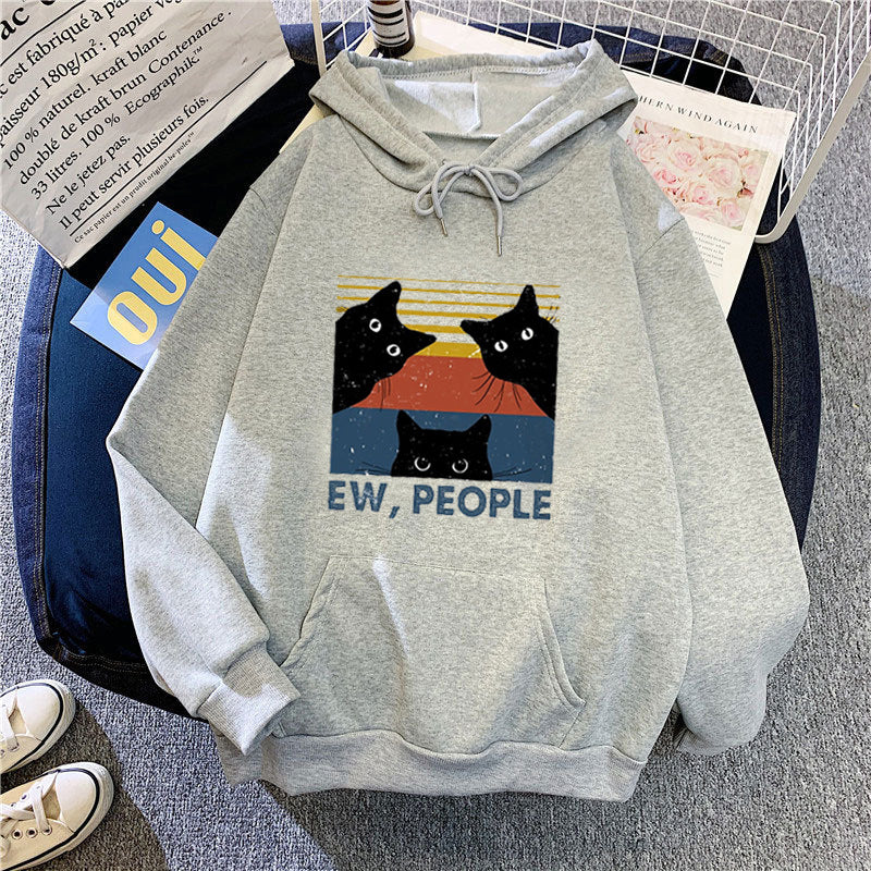 Kvinnors hoodie med stilfullt kattmotiv och inspirerande text Mirla-Eva Jonsson