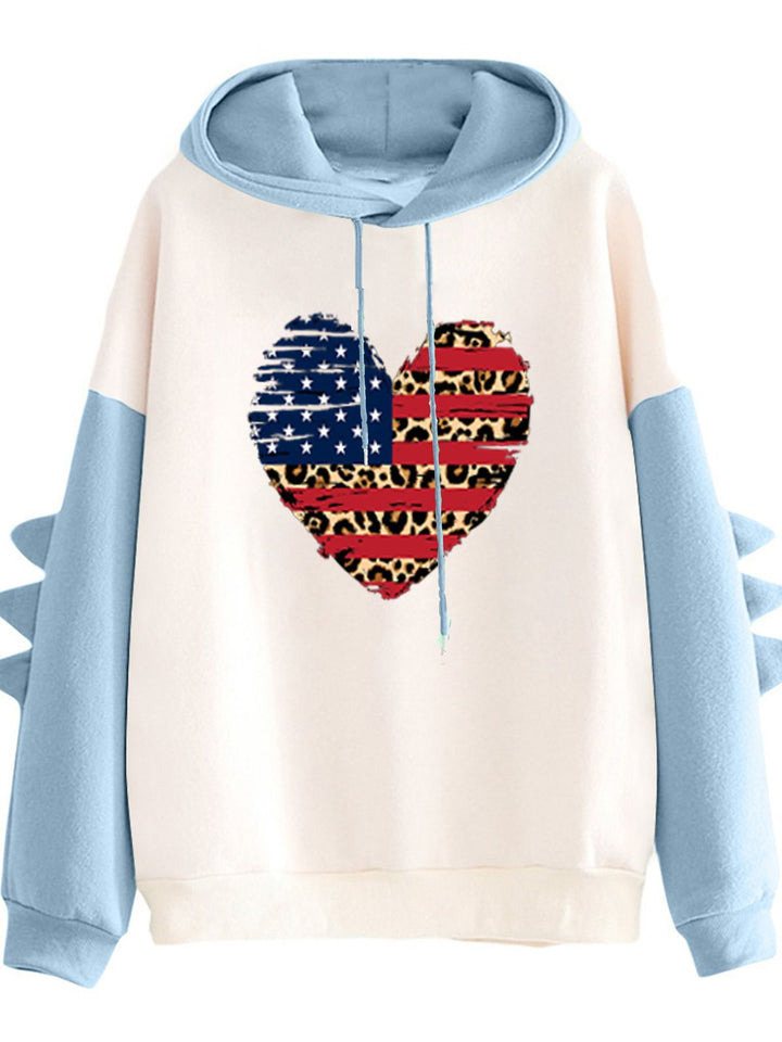 Kvinnors hoodie med unik hjärtdesign och trendiga detaljer Mirla-Eva Jonsson