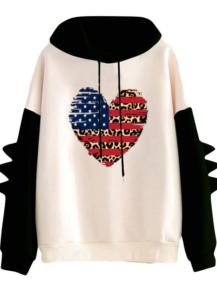 Kvinnors hoodie med unik hjärtdesign och trendiga detaljer Mirla-Eva Jonsson