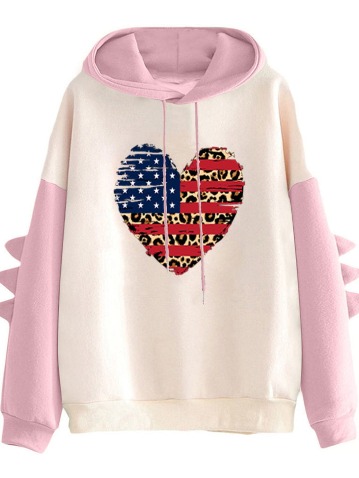 Kvinnors hoodie med unik hjärtdesign och trendiga detaljer Mirla-Eva Jonsson