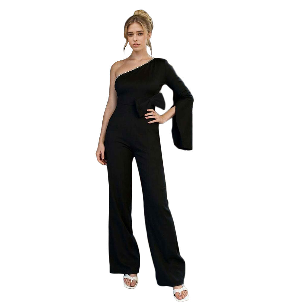 Kvinnors jumpsuit med asymmetrisk design och elegant rosettapplikation Mirla-Eva Jonsson
