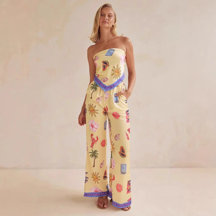 Kvinnors jumpsuit med lekfulla tropiska mönster och elastisk topp Mirla-Eva Jonsson