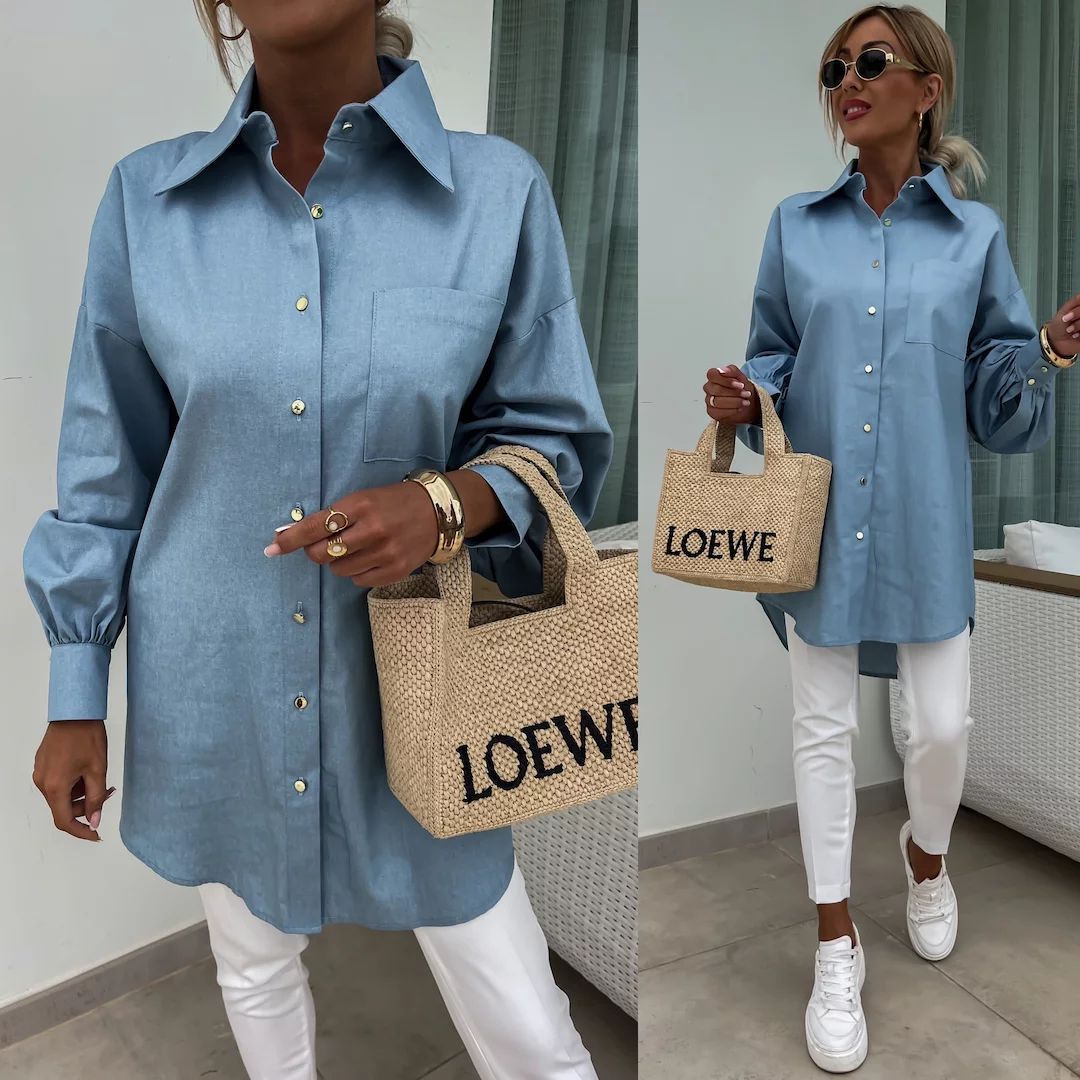 Kvinnors klassiska oversized blus med knappdetaljer och bröstficka Mirla-Eva Jonsson