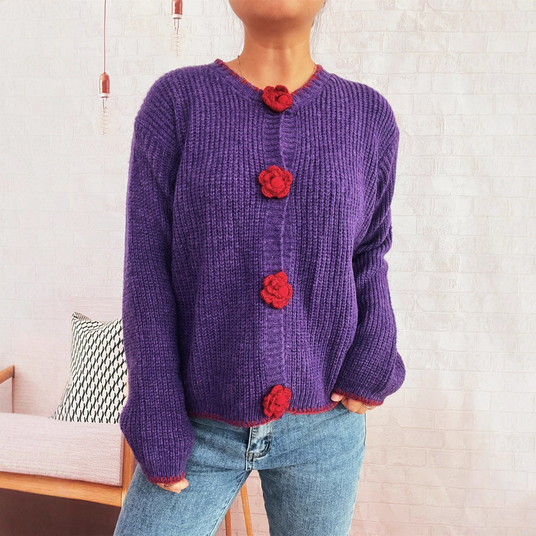 Kvinnors kofta med blommiga knappdetaljer och texturerad tyg Mirla-Eva Jonsson