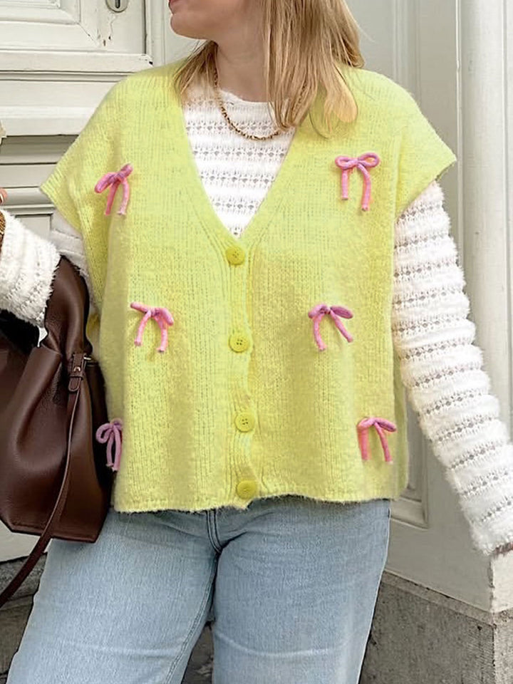 Kvinnors kofta med lekfulla rosett detaljer Mirla-Eva Jonsson