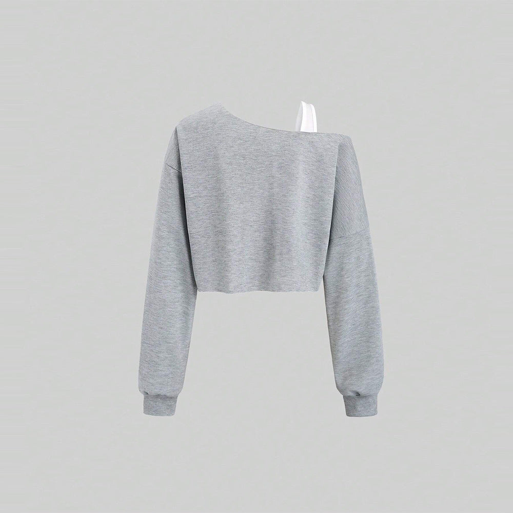 Kvinnors kortad sweatshirt med asymmetrisk design och voluminösa ärmar Mirla-Eva Jonsson