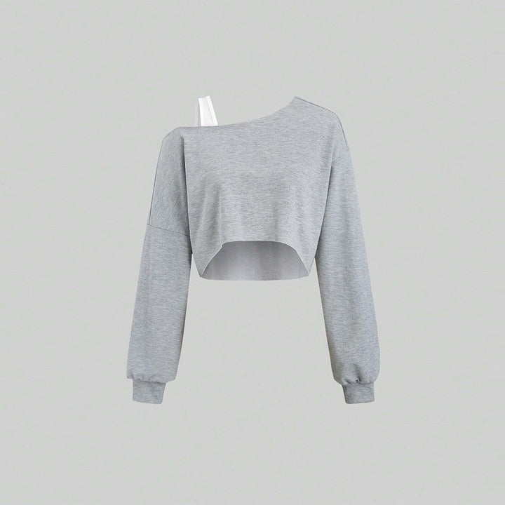 Kvinnors kortad sweatshirt med asymmetrisk design och voluminösa ärmar Mirla-Eva Jonsson