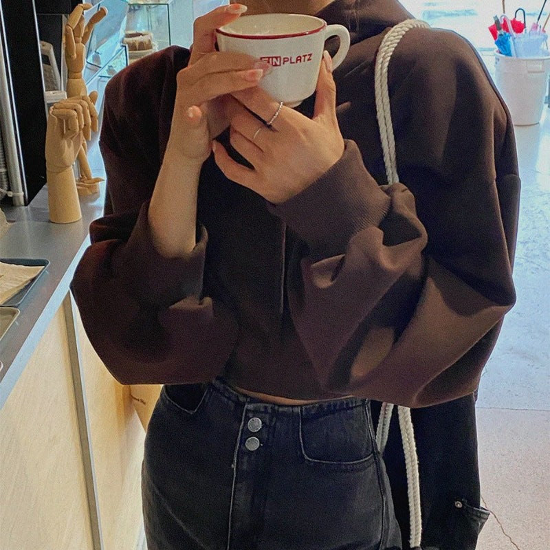 Kvinnors kortärmad hoodie med oversized passform Mirla-Eva Jonsson
