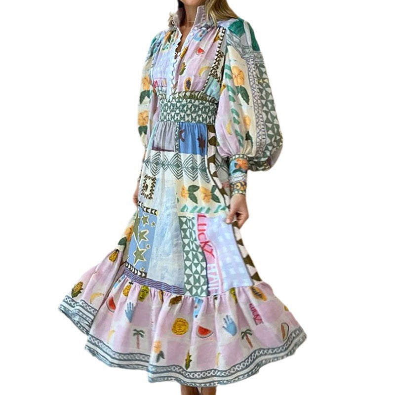Kvinnors lång maxi klänning med färgglad patchwork mönster och voluminösa ärmar Mirla-Eva Jonsson