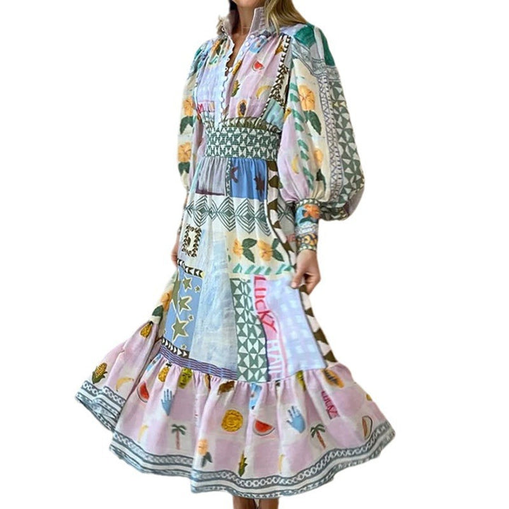 Kvinnors lång maxi klänning med färgglad patchwork mönster och voluminösa ärmar Mirla-Eva Jonsson