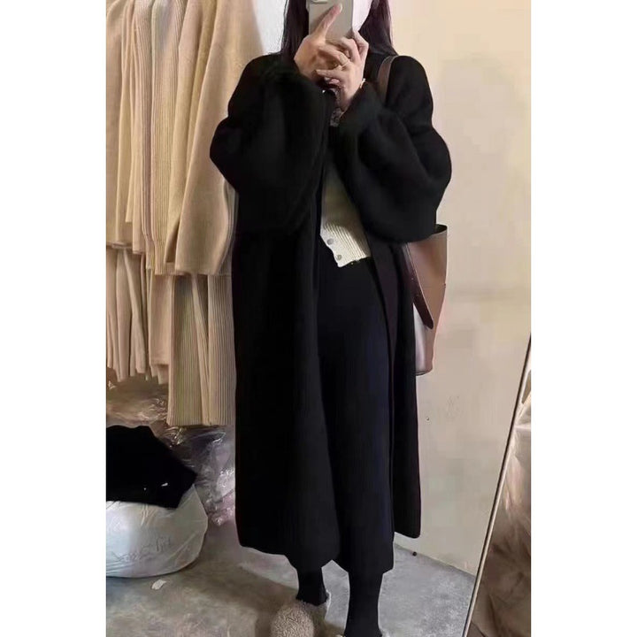 Kvinnors lång stickad kappa med oversized passform och mjukt fleecefoder-Eva Jonsson