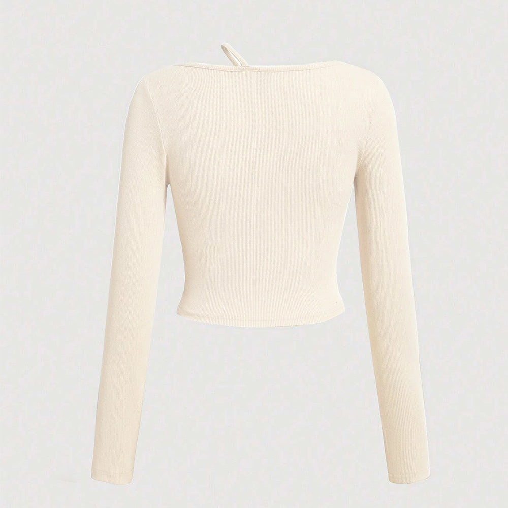 Kvinnors långärmad crop shirt med asymmetrisk halsringning och fin ribbad textur Mirla-Eva Jonsson