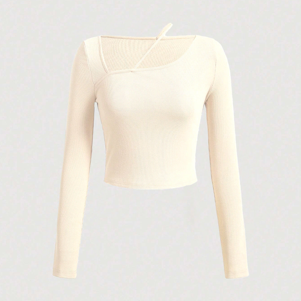 Kvinnors långärmad crop skjorta med asymmetrisk halsringning och fin ribbad textur Mirla-Eva Jonsson
