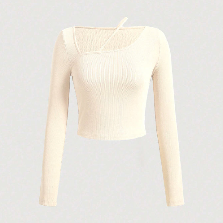 Kvinnors långärmad crop skjorta med asymmetrisk halsringning och fin ribbad textur Mirla-Eva Jonsson