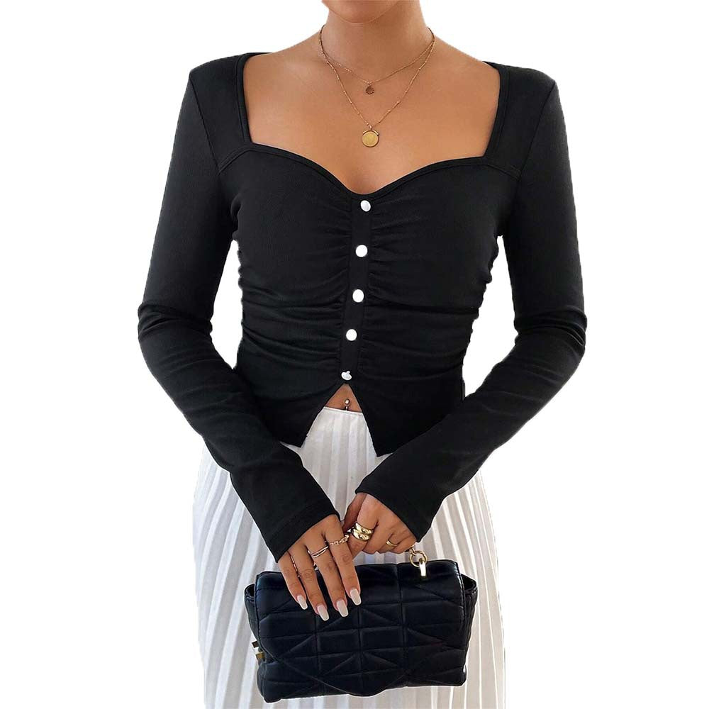 Kvinnors långärmad crop top med dekorativ knappdetalj och rynkad design Mirla-Eva Jonsson