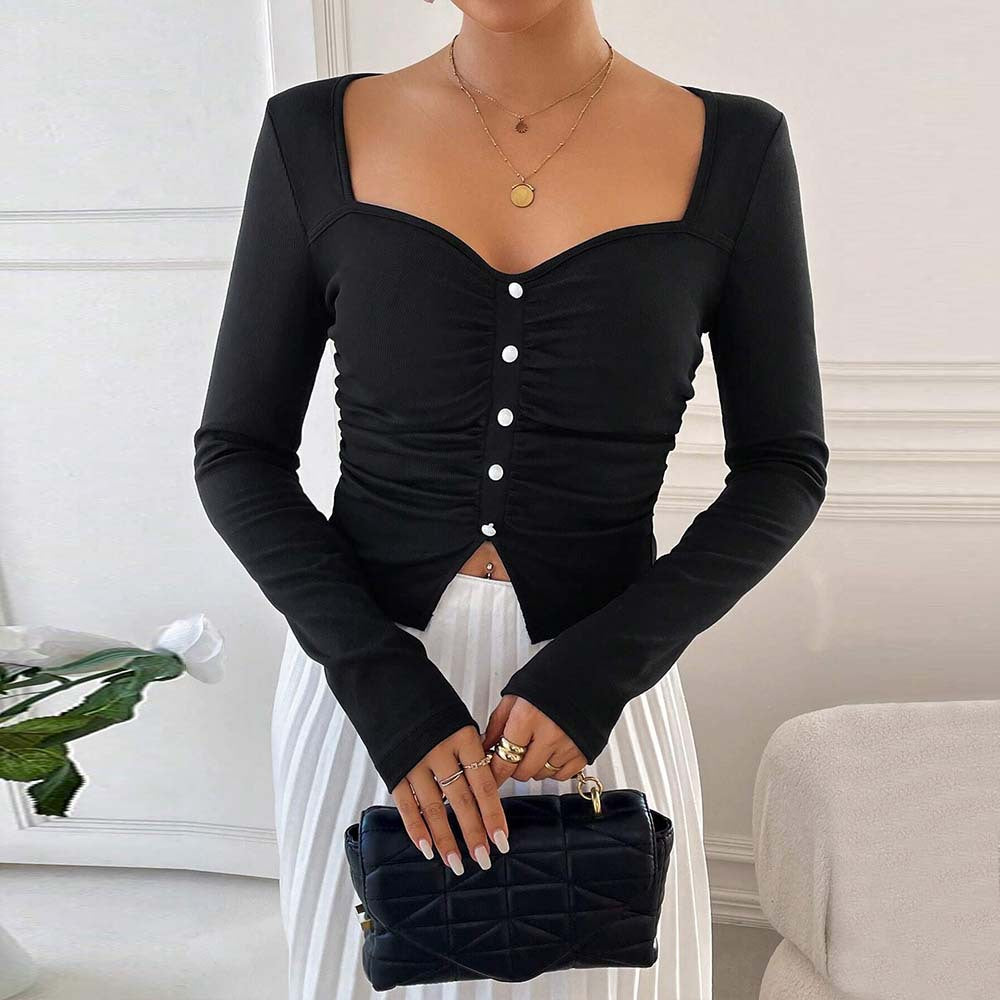 Kvinnors långärmad crop top med dekorativ knappdetalj och rynkad design Mirla-Eva Jonsson