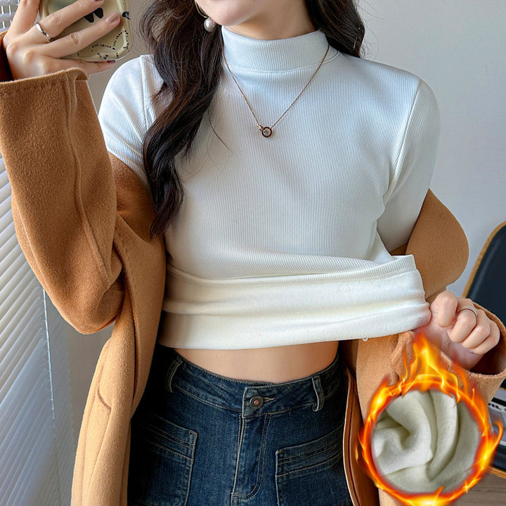 Kvinnors långärmad cropped topp med hög krage och ribbad textur Mirla-Eva Jonsson