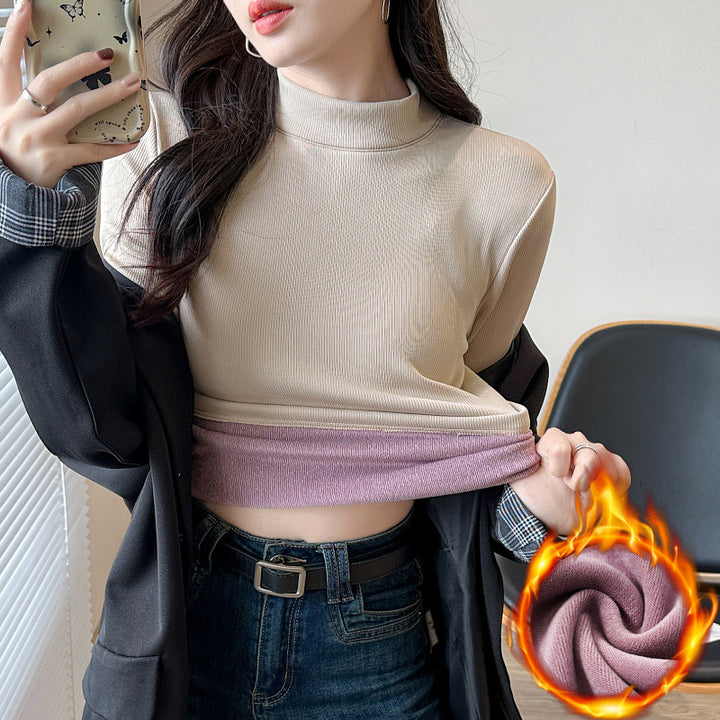 Kvinnors långärmad cropped topp med hög krage och ribbad textur Mirla-Eva Jonsson