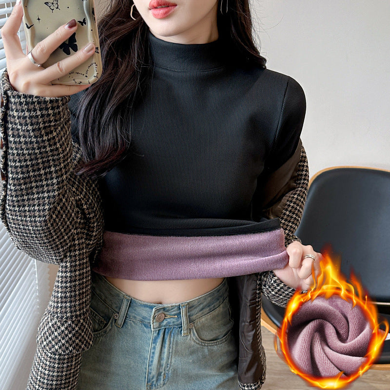 Kvinnors långärmad cropped topp med hög krage och ribbad textur Mirla-Eva Jonsson