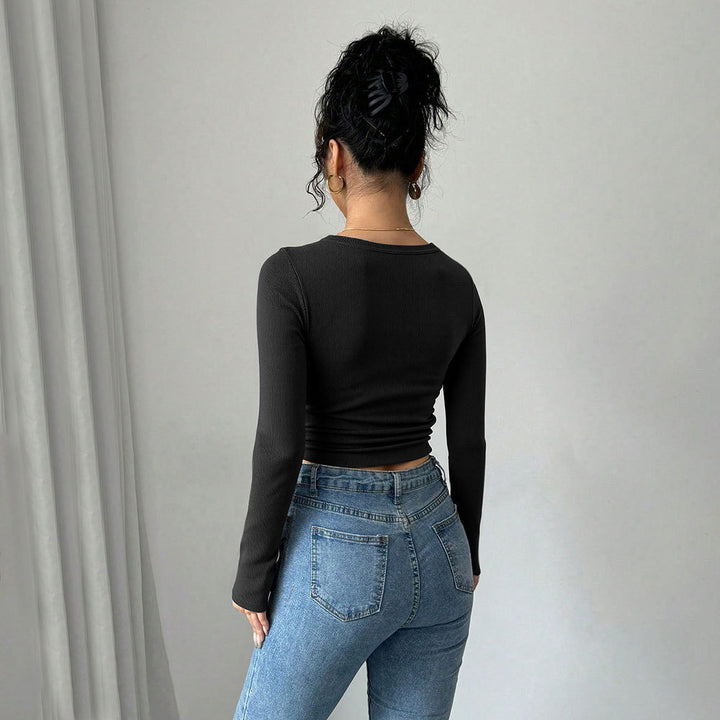 Kvinnors långärmad croptop med elegant knapprad i fram Mirla-Eva Jonsson