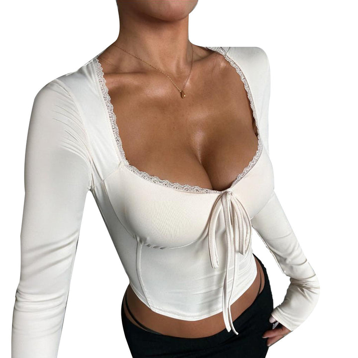 Kvinnors långärmad croptop med sofistikerad knytning och elegant halsringning-Eva Jonsson