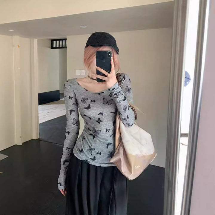 Kvinnors långärmad topp med delikat fjärils mönster Mirla-Eva Jonsson