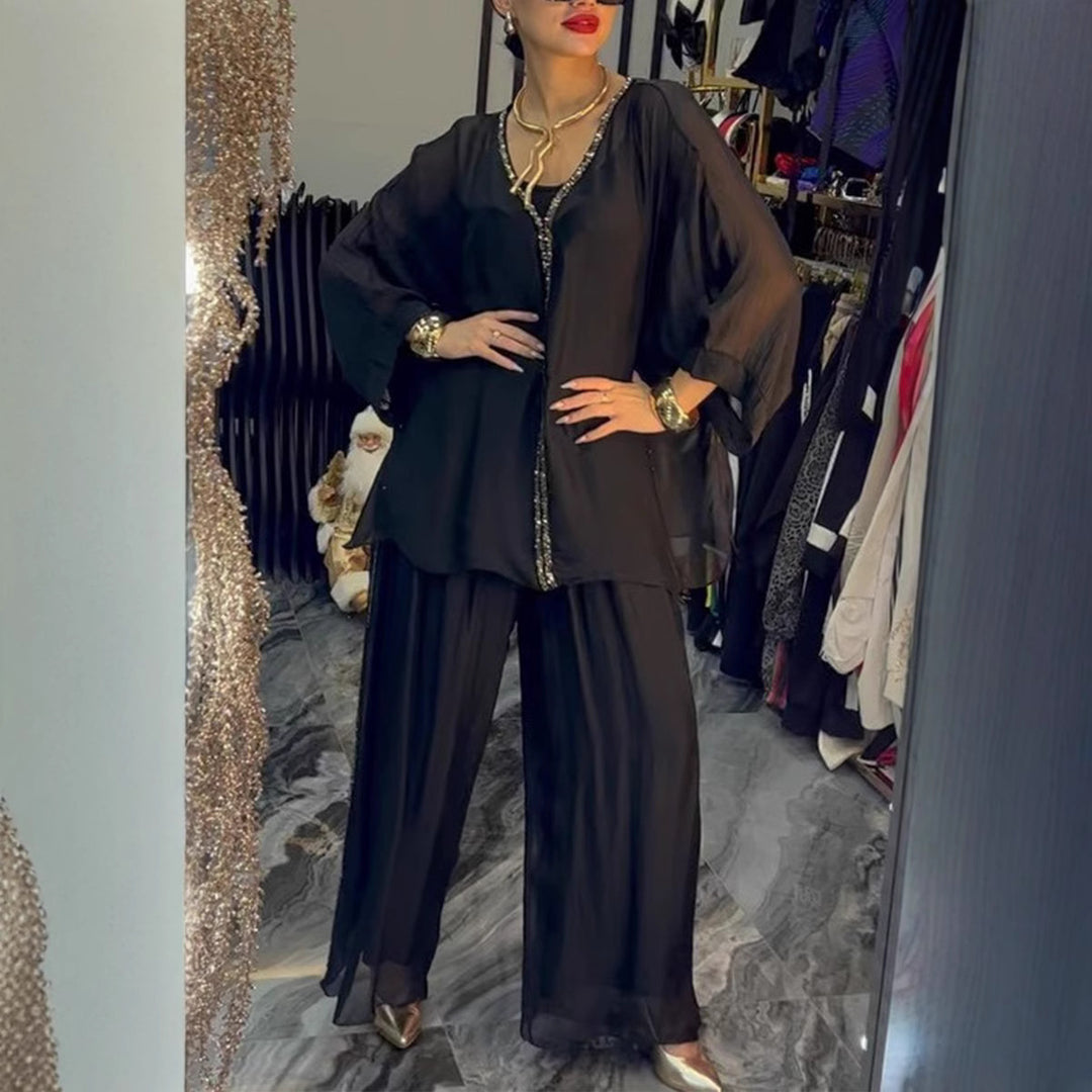 Kvinnors luftig jumpsuit med elegant överdrag och glittrande detaljer Mirla-Eva Jonsson