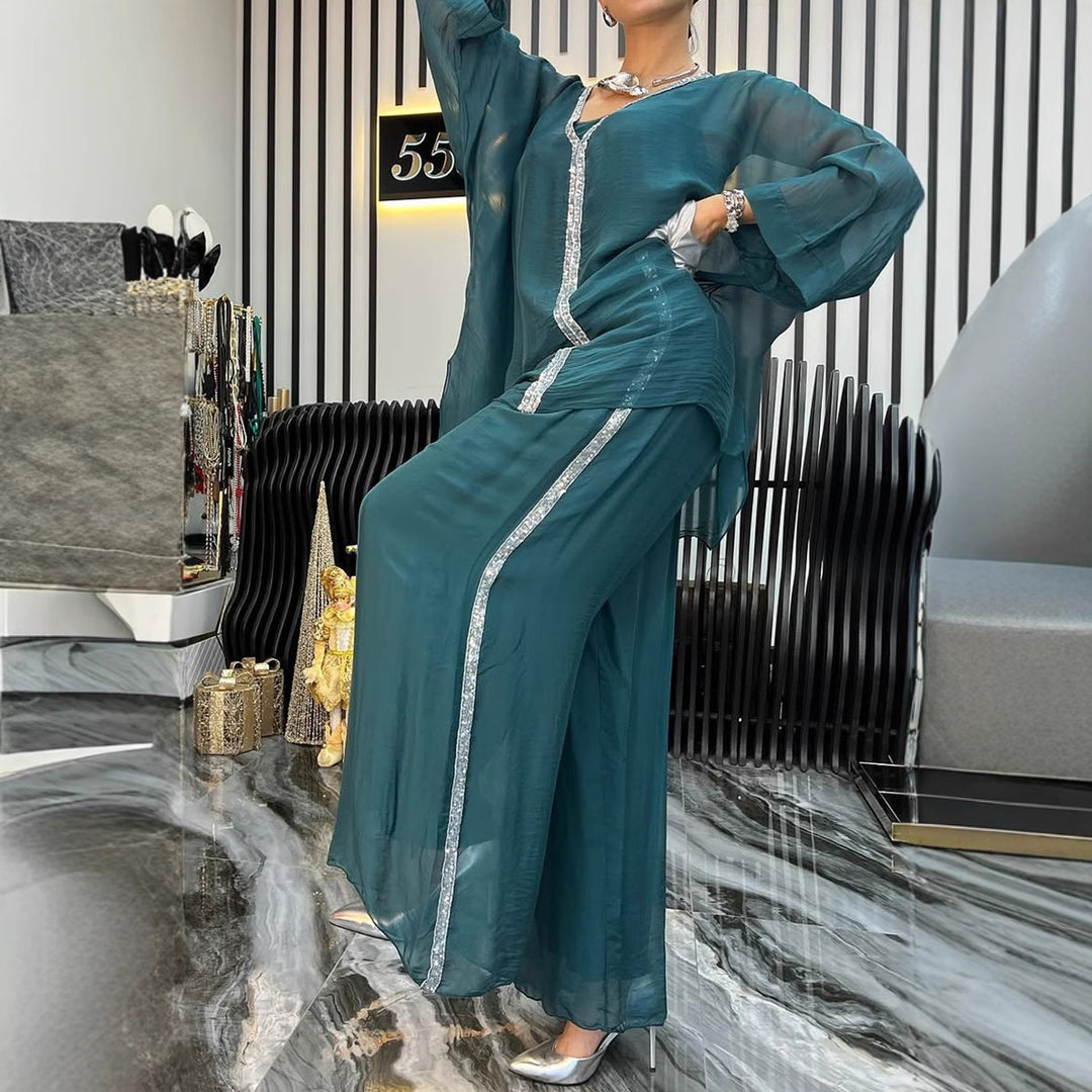 Kvinnors luftig jumpsuit med elegant överdrag och glittrande detaljer Mirla-Eva Jonsson