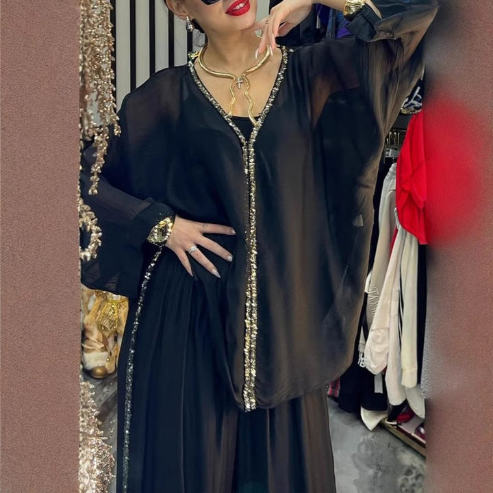 Kvinnors luftig jumpsuit med elegant överdrag och glittrande detaljer Mirla-Eva Jonsson