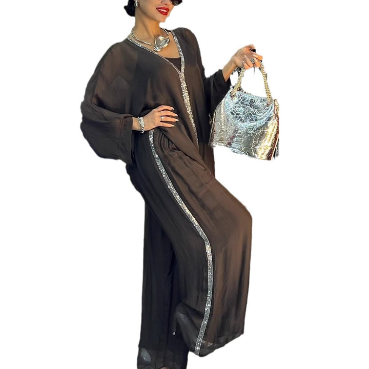 Kvinnors luftig jumpsuit med elegant överdrag och glittrande detaljer Mirla-Eva Jonsson