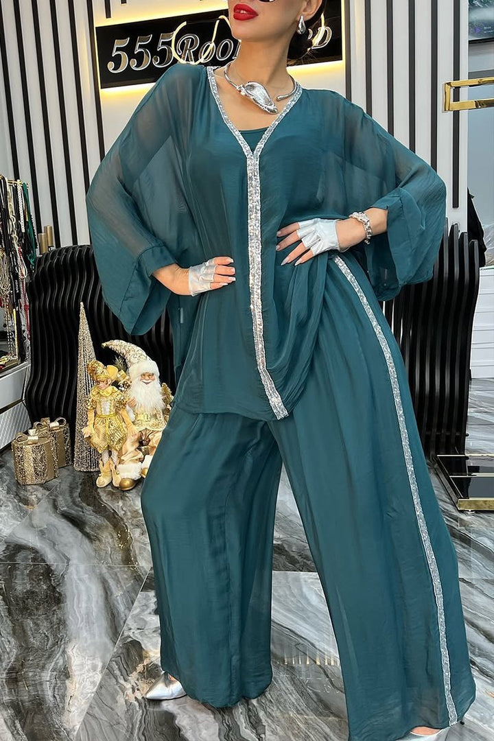 Kvinnors luftig jumpsuit med elegant överdrag och glittrande detaljer Mirla-Eva Jonsson
