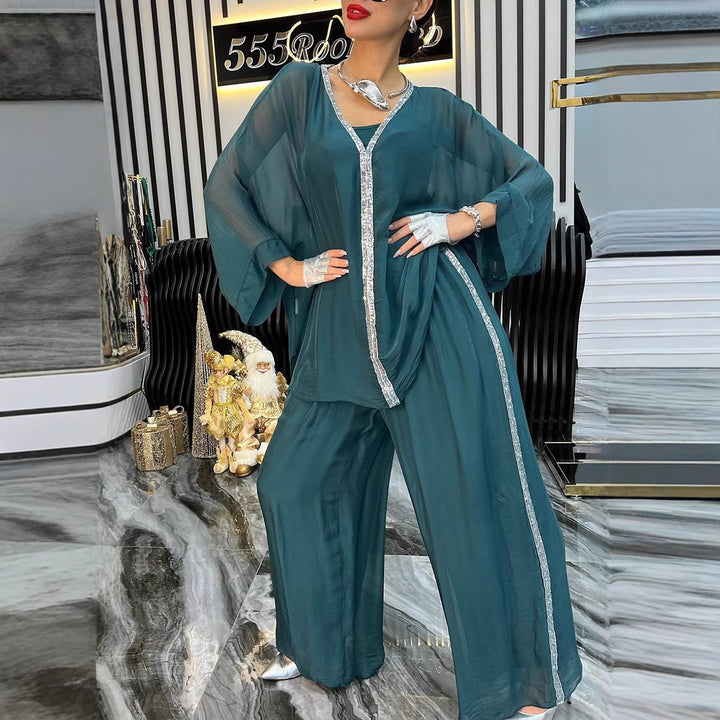 Kvinnors luftig jumpsuit med elegant överdrag och glittrande detaljer Mirla-Eva Jonsson
