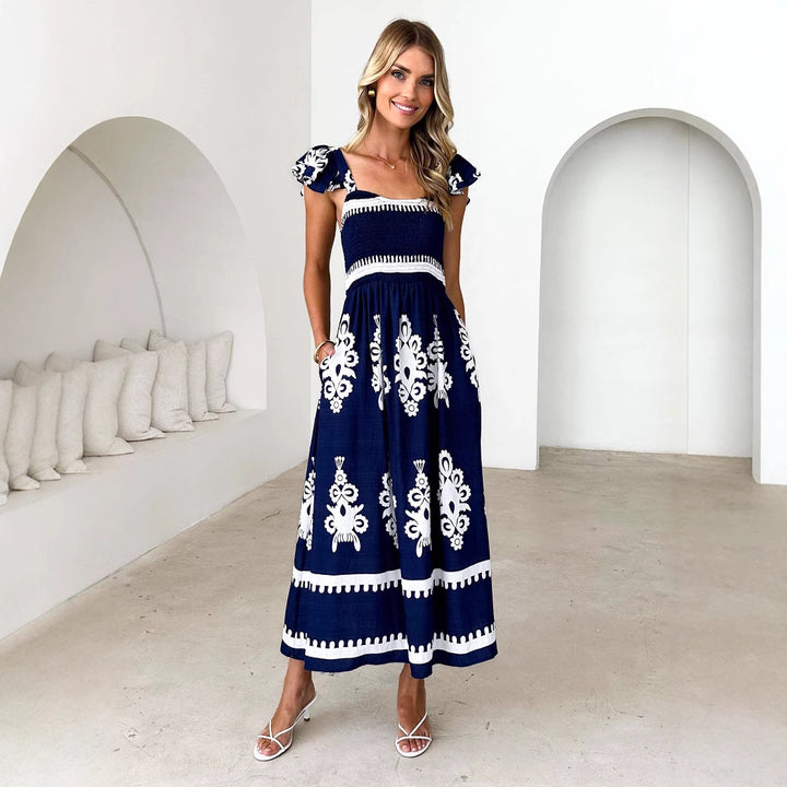 Kvinnors maxi klänning med blommig broderi och volangdetaljer Mirla-Eva Jonsson