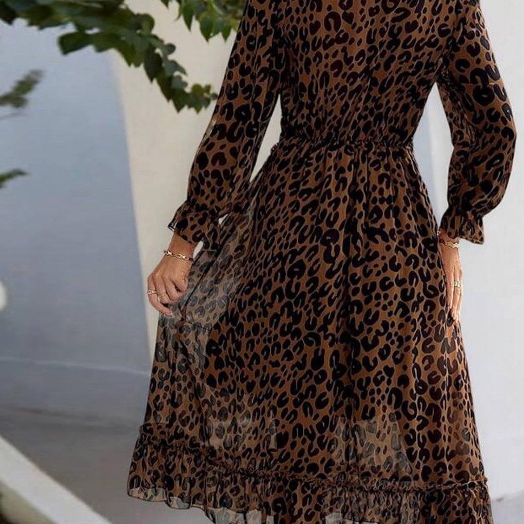Kvinnors maxi klänning med elegant leopardtryck och voluminösa ärmar-Eva Jonsson