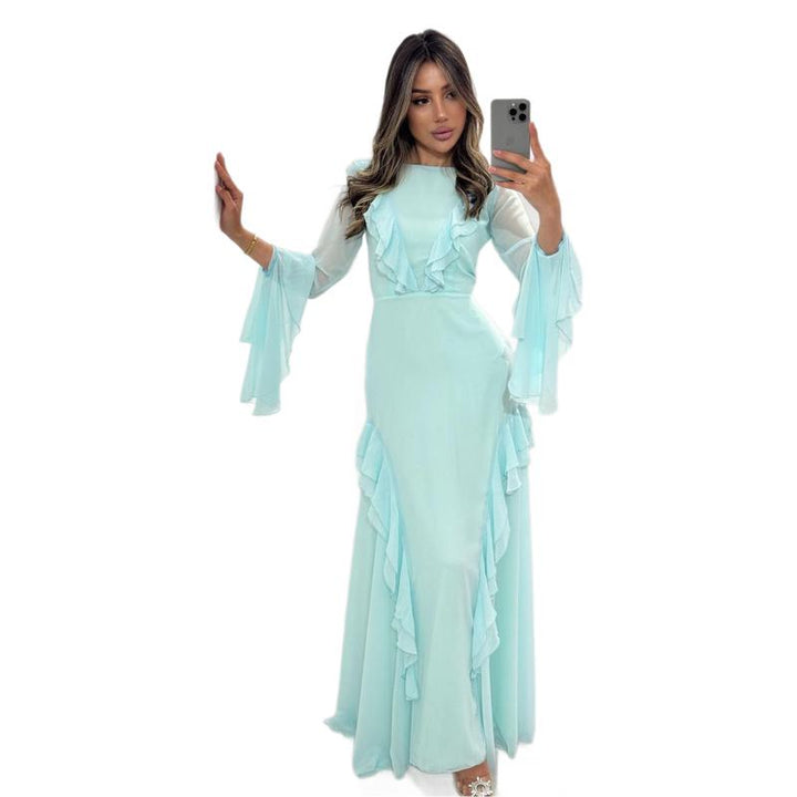 Kvinnors maxi-klänning med eleganta volangdetaljer och flödande ärmar-Eva Jonsson