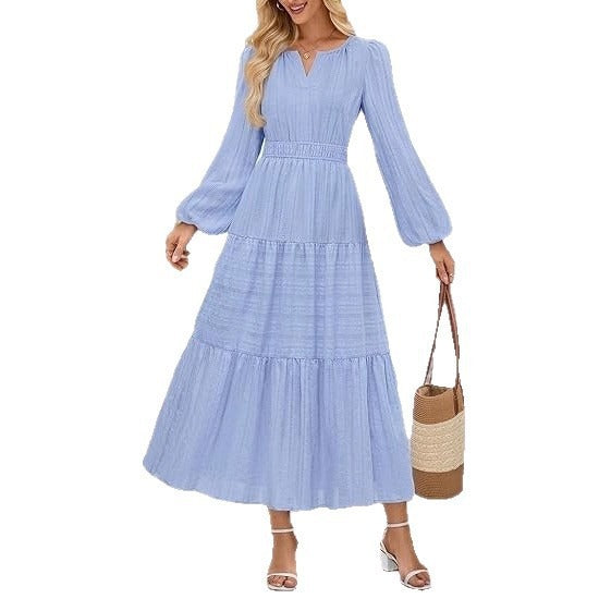 Kvinnors maxikjol med eleganta puffärmar och smockad midja Mirla-Eva Jonsson