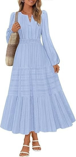 Kvinnors maxikjol med eleganta puffärmar och smockad midja Mirla-Eva Jonsson